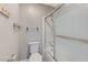 Clean bathroom showing toilet, towel rack, and tub-shower with sliding doors at 4860 Nara Vista Way # 104, Las Vegas, NV 89103