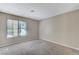 Clean and simple bedroom space with neutral walls, carpet and a large window at 4860 Nara Vista Way # 104, Las Vegas, NV 89103