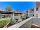 Exterior view of a well-maintained community building with lush landscaping and a clear blue sky backdrop at 4860 Nara Vista Way # 104, Las Vegas, NV 89103