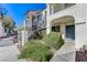 Inviting exterior with landscaped walkway leading to the front door and stairway at 4860 Nara Vista Way # 104, Las Vegas, NV 89103