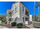 Spanish-style condo building with attractive landscaping and desert plants at 4860 Nara Vista Way # 104, Las Vegas, NV 89103