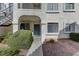 Exterior view of a welcoming condo with lush landscaping, and a stone walkway to the entrance at 4860 Nara Vista Way # 104, Las Vegas, NV 89103