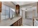 Galley-style kitchen with an undermount sink and a view to the adjacent living area at 4860 Nara Vista Way # 104, Las Vegas, NV 89103