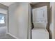 Convenient laundry closet with a stacked washer and dryer setup at 4860 Nara Vista Way # 104, Las Vegas, NV 89103