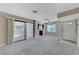 Spacious living area with sliding door access to the patio and bar seating at 4860 Nara Vista Way # 104, Las Vegas, NV 89103