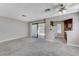 Open-concept living area leads to a balcony and features a partial view of the kitchen at 4860 Nara Vista Way # 104, Las Vegas, NV 89103