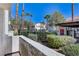 Patio with a view of a well-maintained community pool and lush landscaping at 4860 Nara Vista Way # 104, Las Vegas, NV 89103
