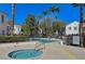 Relaxing pool and spa area with palm trees and comfortable lounge chairs at 4860 Nara Vista Way # 104, Las Vegas, NV 89103