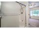 Ensuite bathroom featuring a shower with glass door and access to primary bedroom at 7625 Fieldfare Dr, North Las Vegas, NV 89084