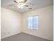 A cozy bedroom features a ceiling fan and a window providing natural light at 7625 Fieldfare Dr, North Las Vegas, NV 89084