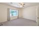Bright bedroom with large window and plush carpeting, offering a cozy retreat at 7625 Fieldfare Dr, North Las Vegas, NV 89084