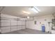 Clean two car garage featuring an overhead door, and a water heater at 7625 Fieldfare Dr, North Las Vegas, NV 89084
