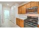 Well-equipped kitchen showcases stainless steel appliances, wood cabinetry, and functional layout at 7625 Fieldfare Dr, North Las Vegas, NV 89084