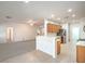 Inviting open kitchen featuring stainless steel appliances, bright white countertops, and a breakfast bar at 7625 Fieldfare Dr, North Las Vegas, NV 89084