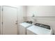 Laundry room with a modern washer and dryer at 7625 Fieldfare Dr, North Las Vegas, NV 89084