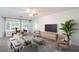 Bright living room featuring large windows, modern furniture and lots of natural light at 7625 Fieldfare Dr, North Las Vegas, NV 89084