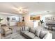 Open-concept living room and kitchen with a modern design and neutral color palette at 7625 Fieldfare Dr, North Las Vegas, NV 89084