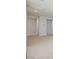 Hallway with neutral carpet, doors, and storage at 8401 Waterwood St, Las Vegas, NV 89166
