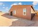 This backyard features a stucco exterior, a new home build and a block wall at 400 S Jena St, Henderson, NV 89015