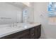 Double vanity bathroom with modern dark brown cabinets at 400 S Jena St, Henderson, NV 89015