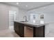 Modern kitchen island with stainless steel dishwasher at 400 S Jena St, Henderson, NV 89015