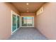 Covered patio featuring sliding glass doors, recessed lighting, and brick flooring at 400 S Jena St, Henderson, NV 89015