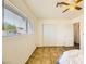 Bright bedroom features a large window and neutral-toned tiled floor at 425 Oil Lantern Ln, Las Vegas, NV 89145
