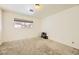 A spacious bedroom with wall to wall carpeting and a sunlit window at 425 Oil Lantern Ln, Las Vegas, NV 89145