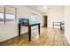 A bright dining area with tile flooring and natural light from the sliding glass door and windows at 425 Oil Lantern Ln, Las Vegas, NV 89145
