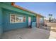 Charming covered front porch featuring unique brickwork and a convenient entry area at 425 Oil Lantern Ln, Las Vegas, NV 89145