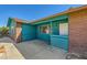 Inviting covered front porch with unique brickwork and comfortable space at 425 Oil Lantern Ln, Las Vegas, NV 89145