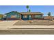 Charming single-story home featuring a unique exterior and a desert landscaped front yard at 425 Oil Lantern Ln, Las Vegas, NV 89145