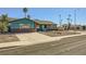 View of a quaint single-story home with low maintenance desert landscaping in the front yard at 425 Oil Lantern Ln, Las Vegas, NV 89145