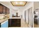Bright kitchen featuring bar seating, stainless appliances, and access to other rooms at 425 Oil Lantern Ln, Las Vegas, NV 89145