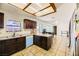 Stylish kitchen with breakfast bar, custom lighting, and neutral color palette at 425 Oil Lantern Ln, Las Vegas, NV 89145