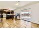 Open kitchen and dining area with dark cabinets and stainless steel appliances at 425 Oil Lantern Ln, Las Vegas, NV 89145