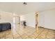 Expansive living area with tile floors, neutral walls, and versatile layout options at 425 Oil Lantern Ln, Las Vegas, NV 89145