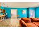 Living room featuring a tiled floor and bright blue walls at 425 Oil Lantern Ln, Las Vegas, NV 89145