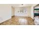 Bright living room with tile flooring, large windows, and a neutral color scheme at 425 Oil Lantern Ln, Las Vegas, NV 89145