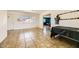 Open living area featuring tile floors, a large window, and access to other rooms at 425 Oil Lantern Ln, Las Vegas, NV 89145