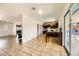 Bright living room area seamlessly connecting the kitchen with sliding glass doors and natural light at 425 Oil Lantern Ln, Las Vegas, NV 89145
