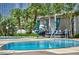 Beautiful outdoor pool area with palm trees, lounge chairs, and lush landscaping at 3750 Las Vegas Blvd # 4303, Las Vegas, NV 89158