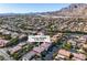 Wide aerial view showcasing the property's location, surrounded by homes and mountain views in a well-planned community at 10105 Shore Pine Ave, Las Vegas, NV 89129