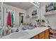Bright bathroom with a double vanity, a large mirror, and plenty of storage and counter space at 10105 Shore Pine Ave, Las Vegas, NV 89129