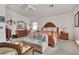 Large main bedroom featuring natural light, ceiling fan, bed, dresser and sofa at 10105 Shore Pine Ave, Las Vegas, NV 89129