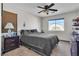 Comfortable bedroom with a ceiling fan and natural light at 10105 Shore Pine Ave, Las Vegas, NV 89129