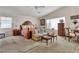 Spacious primary bedroom with a seating area, dresser, and bright windows at 10105 Shore Pine Ave, Las Vegas, NV 89129