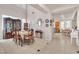 Open concept dining room with tiled floors and elegant furniture; an inviting space for entertaining guests at 10105 Shore Pine Ave, Las Vegas, NV 89129
