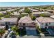 Inviting two-story home with a well-manicured front lawn and three-car garage in a picturesque neighborhood at 10105 Shore Pine Ave, Las Vegas, NV 89129