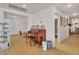Inviting hallway with hardwood floors and a charming piano, leading to other rooms in the home at 10105 Shore Pine Ave, Las Vegas, NV 89129